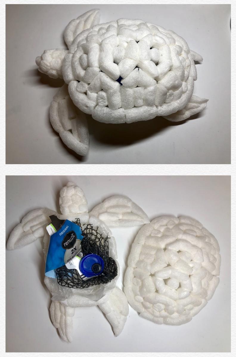 A sea turtle sculpted out of packing peanuts. Other plastic materials such as a plastic bag, a plastic mesh bag and a plastic button are used to express ingested plastics in a turtle's body