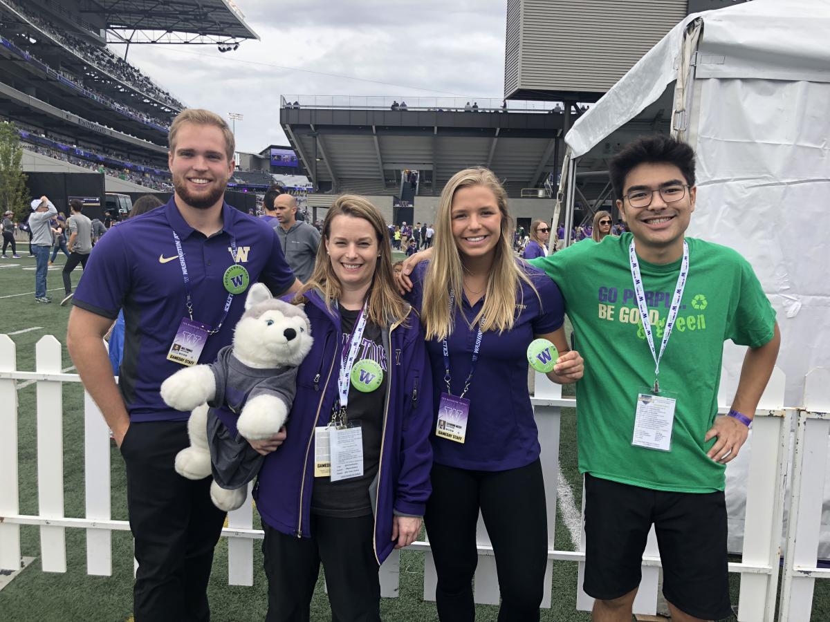 volunteers at a UW football game