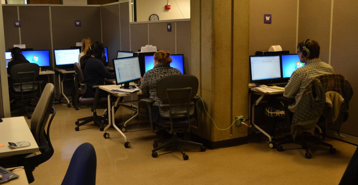 Staff in the UW Office of Admissions sitting at computers.