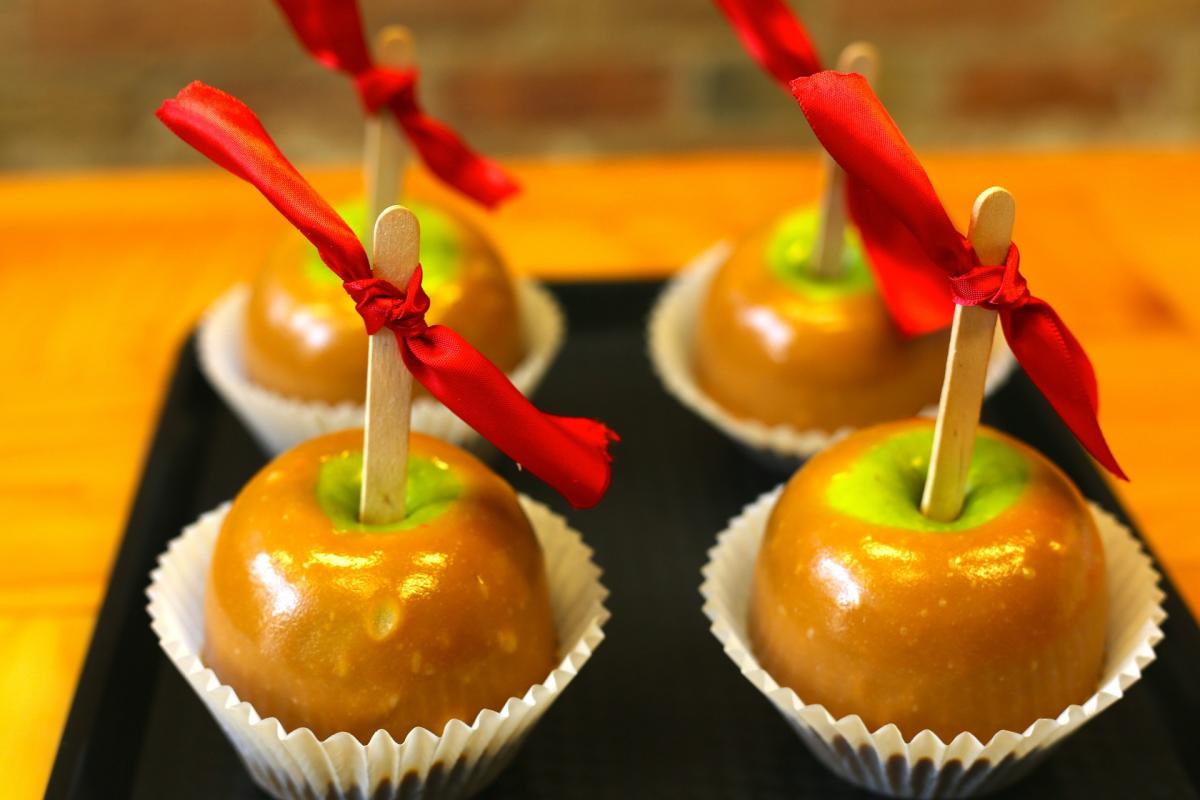 Four caramel apples.