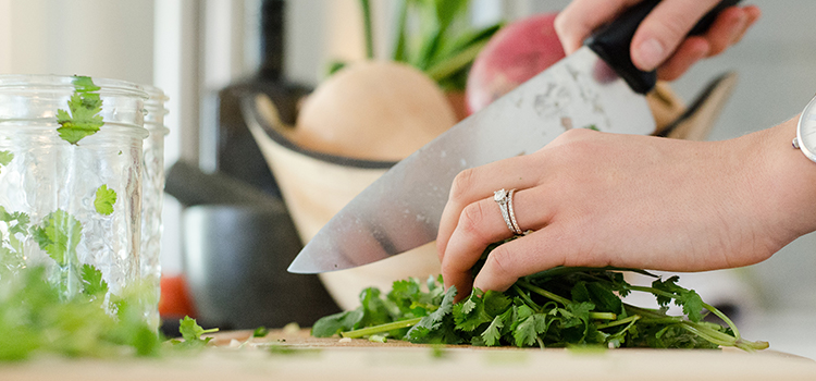 person cutting vegetables