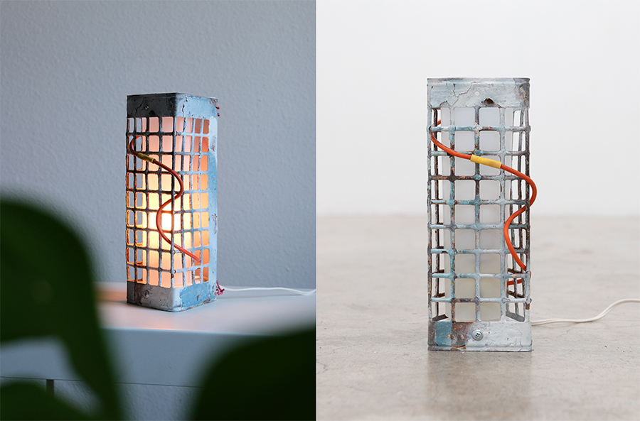 two viewpoints of a lamp constructed of derelict metal grate material with a red wire interspersed within the openings; one with the lamp lit and one without