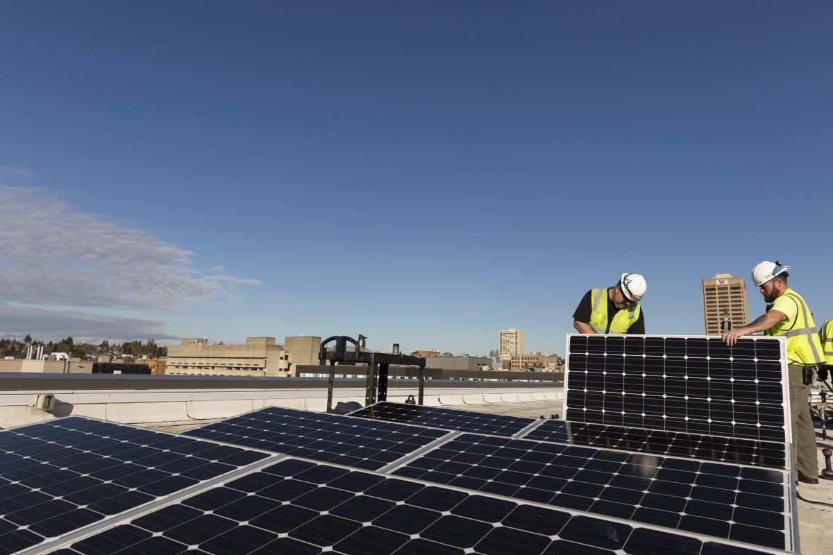 Workers installing a solar array