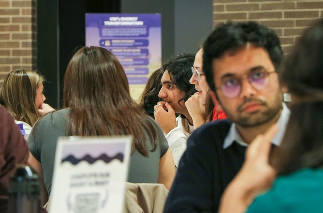 attendees discussing sustainability during the kickoff event