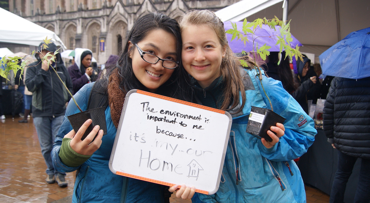 Students on Red Square holding whiteboard