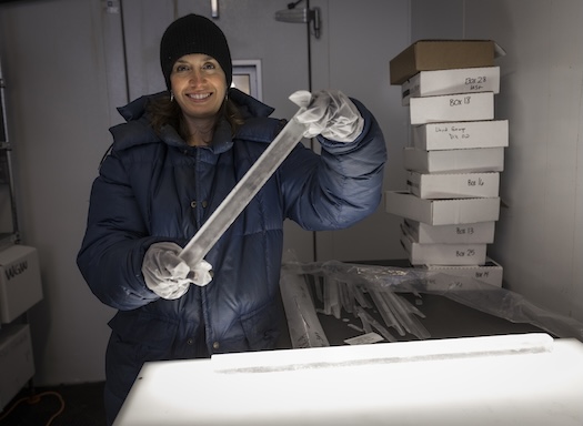 UW scientist holding ice core