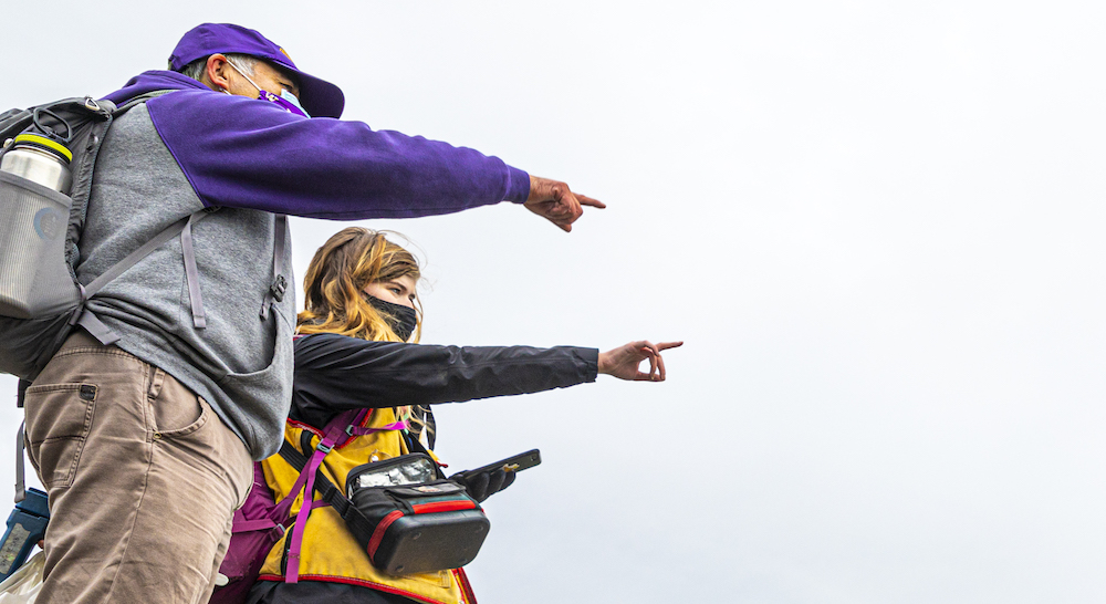 UW faculty and student pointing