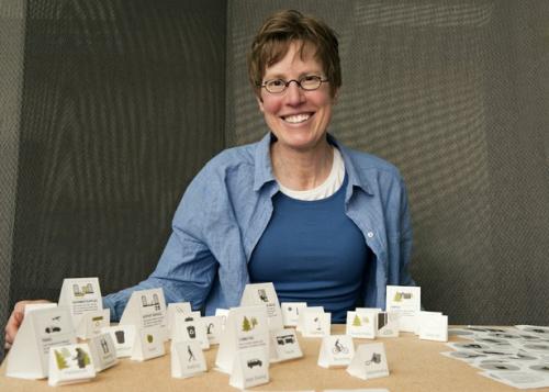 Marilyn Ostergren, a doctoral student in the Information School, uses a visual display to help organize the information about sustainability on the new ESS dashboard