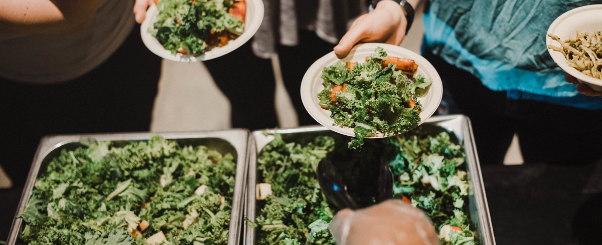 Serving salads to students