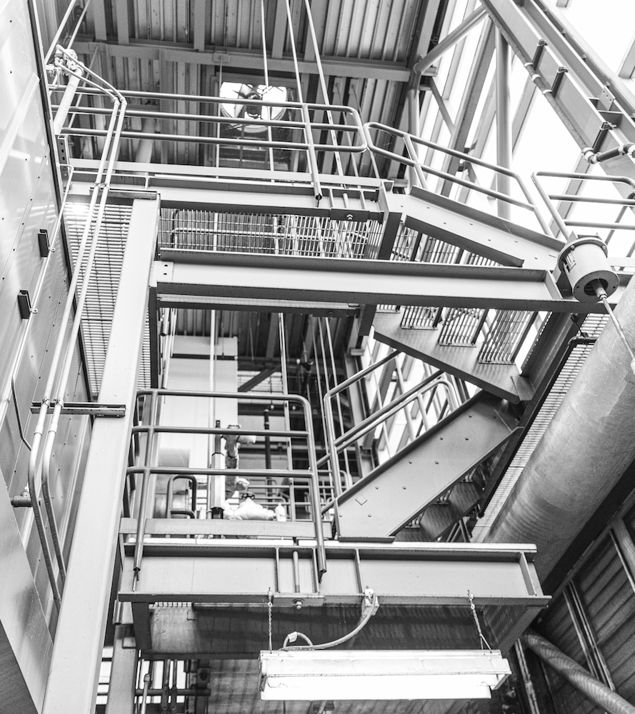 view of pipes, steel walkways and stairs in Power Plant